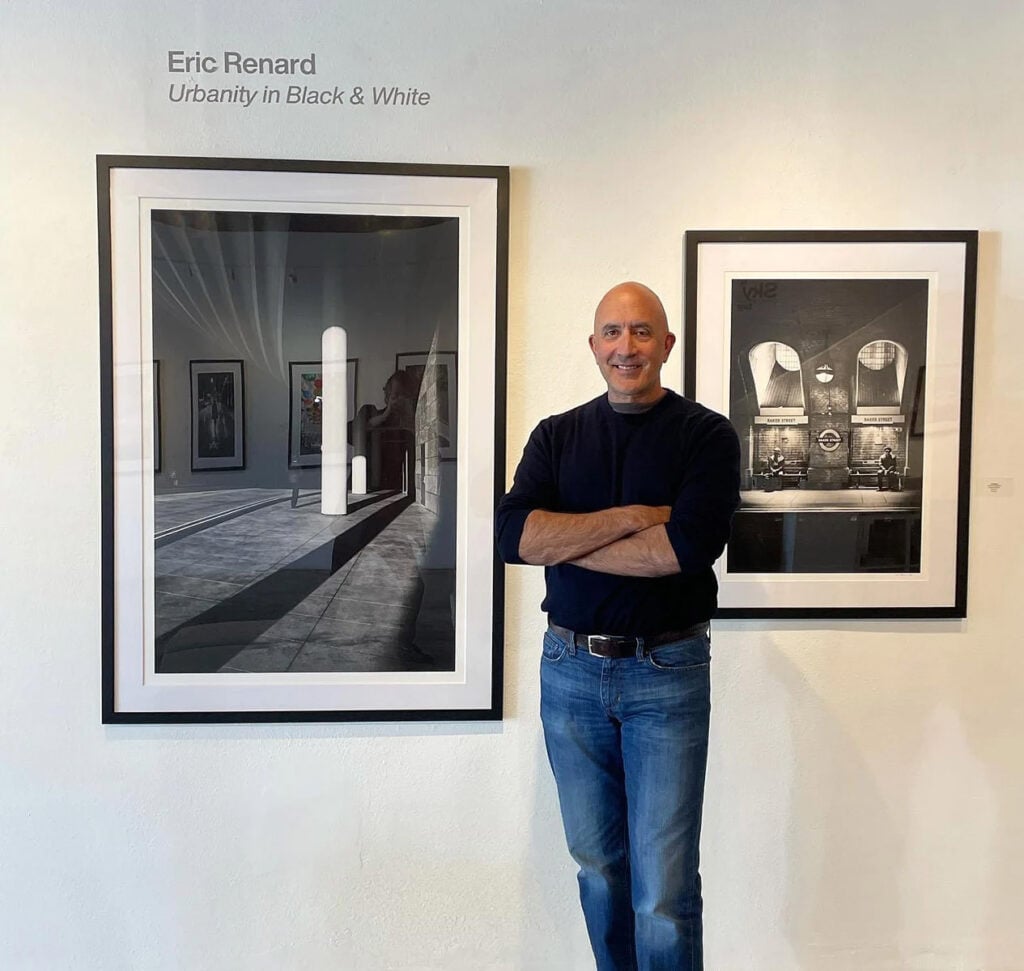 Eric Renard poses with his artwork
