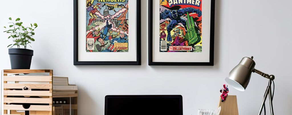 Image of comics framed above a desk. 